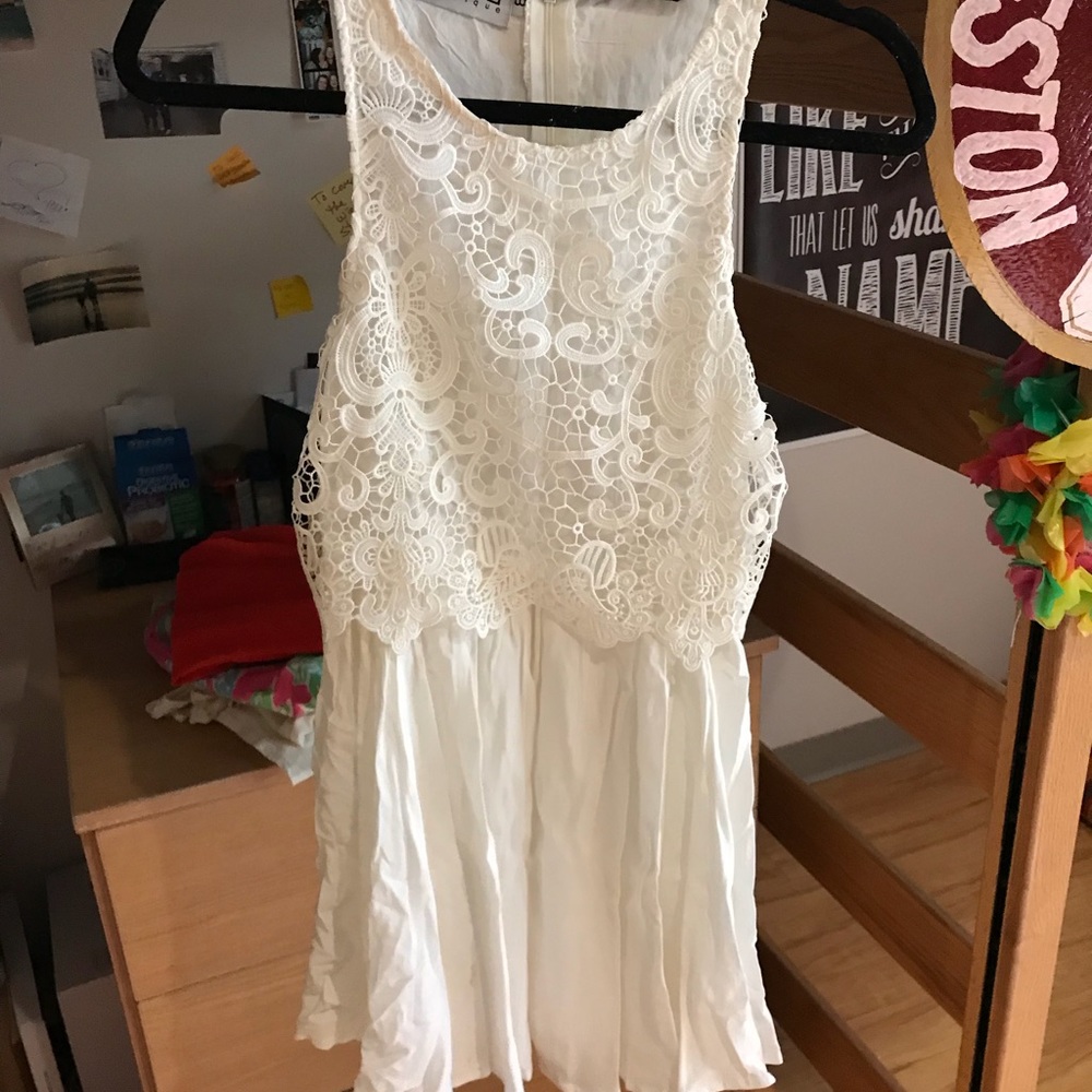 White dress with lace over lay